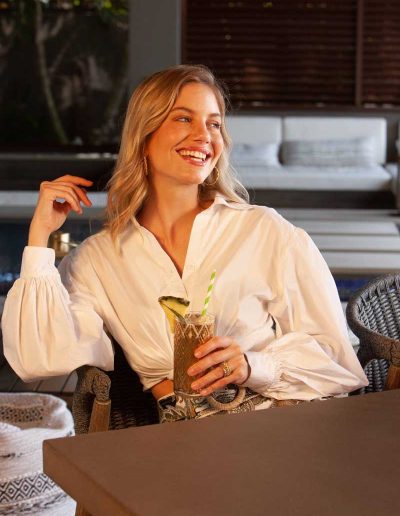 Woman enjoying a mixed drink